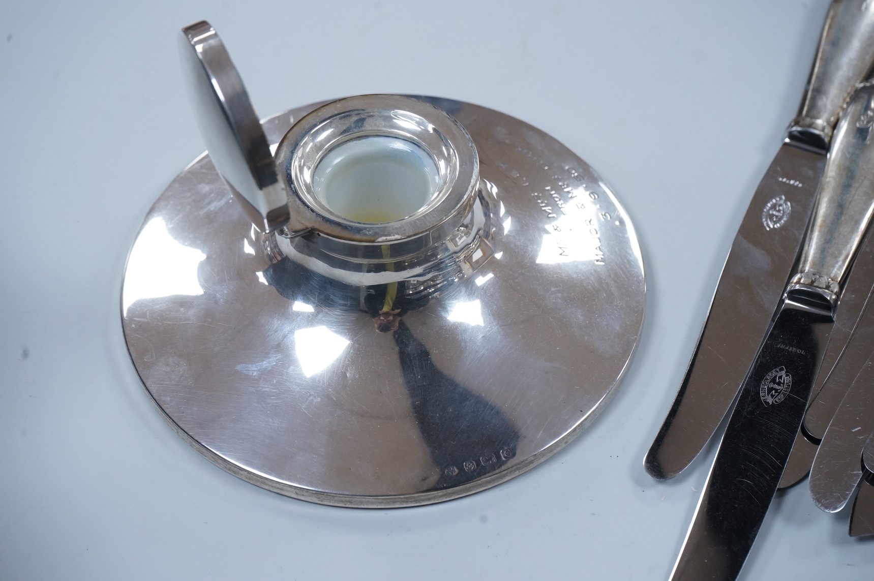 A George V loaded silver capstan-shaped inkwell, mm. W N Ltd, Birmingham 1931, 16.5cm diameter and twelve various Danish loaded silver handled knives with stainless steel blades